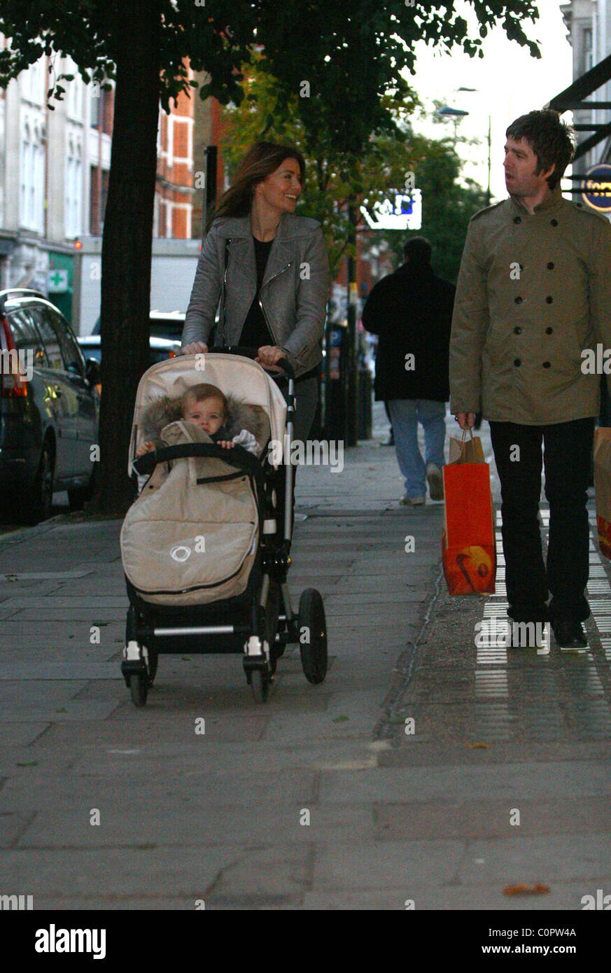 Noel Gallagher and long term girlfriend Sara MacDonald out with their son Donovan Rory MacDonald Gallagher, stop at hair Stock Photo