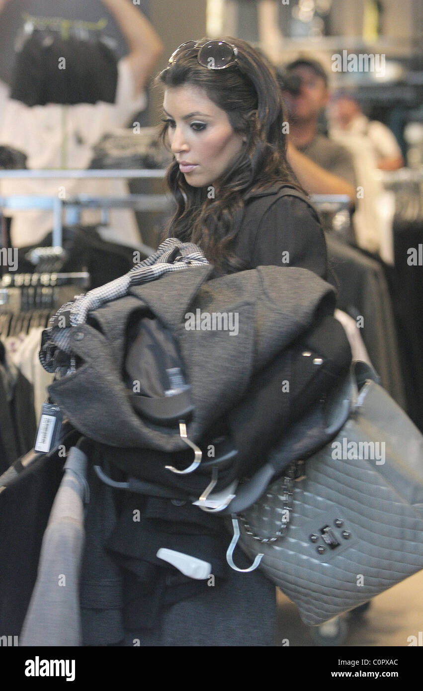 Kim Kardashian films a segment of her reality TV show while shopping at H&M boutique Los Angeles, California - 18.09.08 Stock Photo