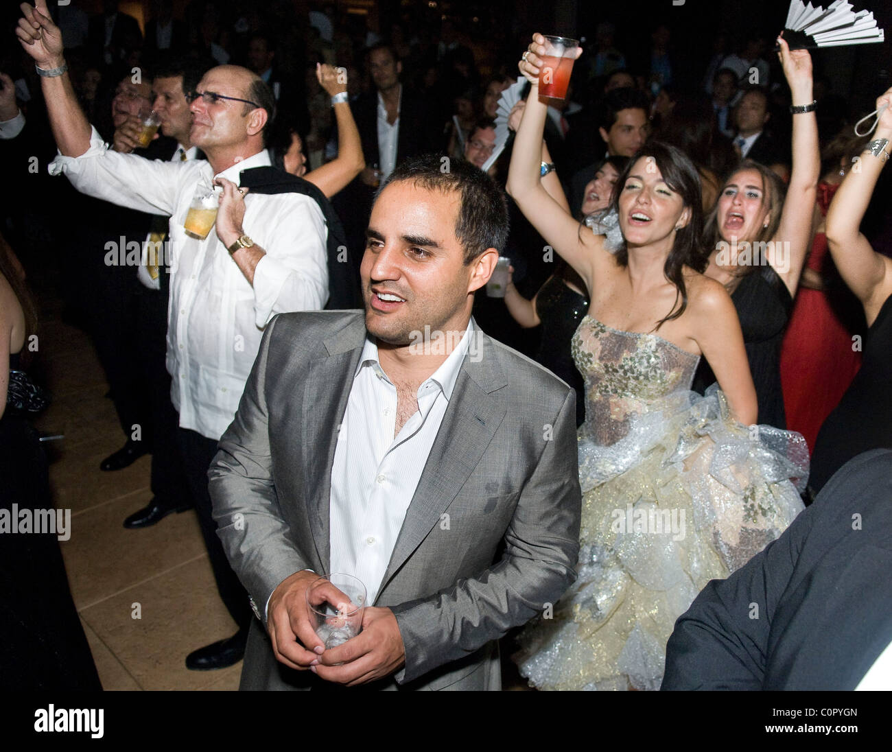 NASCAR driver Juan Pablo Montoya and wife, Connie Freydell, behind Montoya at right, at Colombian singer, Carlos Vives, Be Live Stock Photo