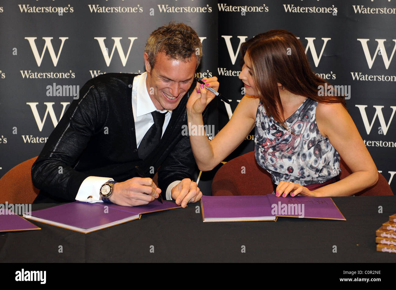 Mark Foster And Lisa Snowdon Sign Copies Of The New Strictly Come
