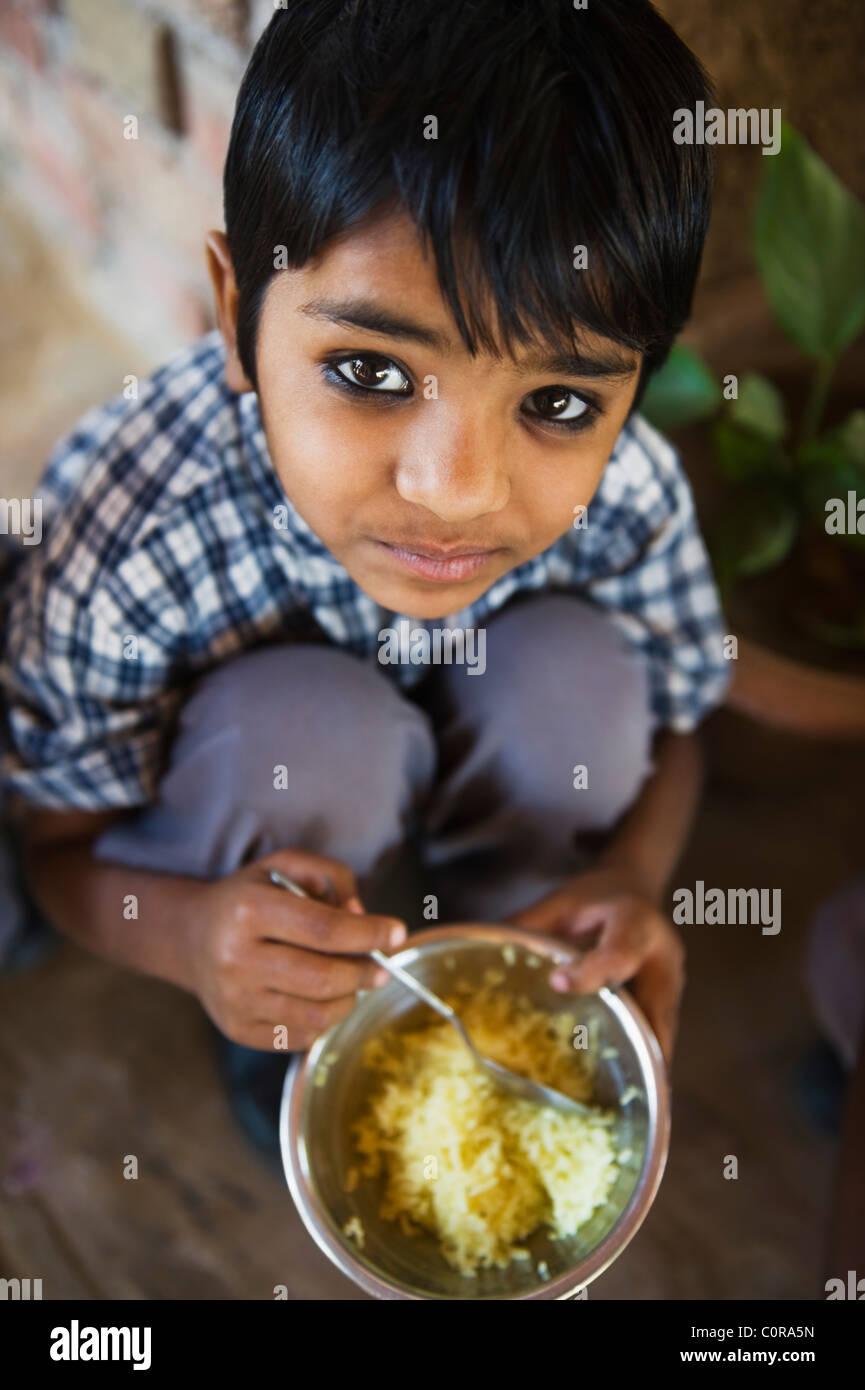Indian child eating rice hi-res stock photography and images - Alamy
