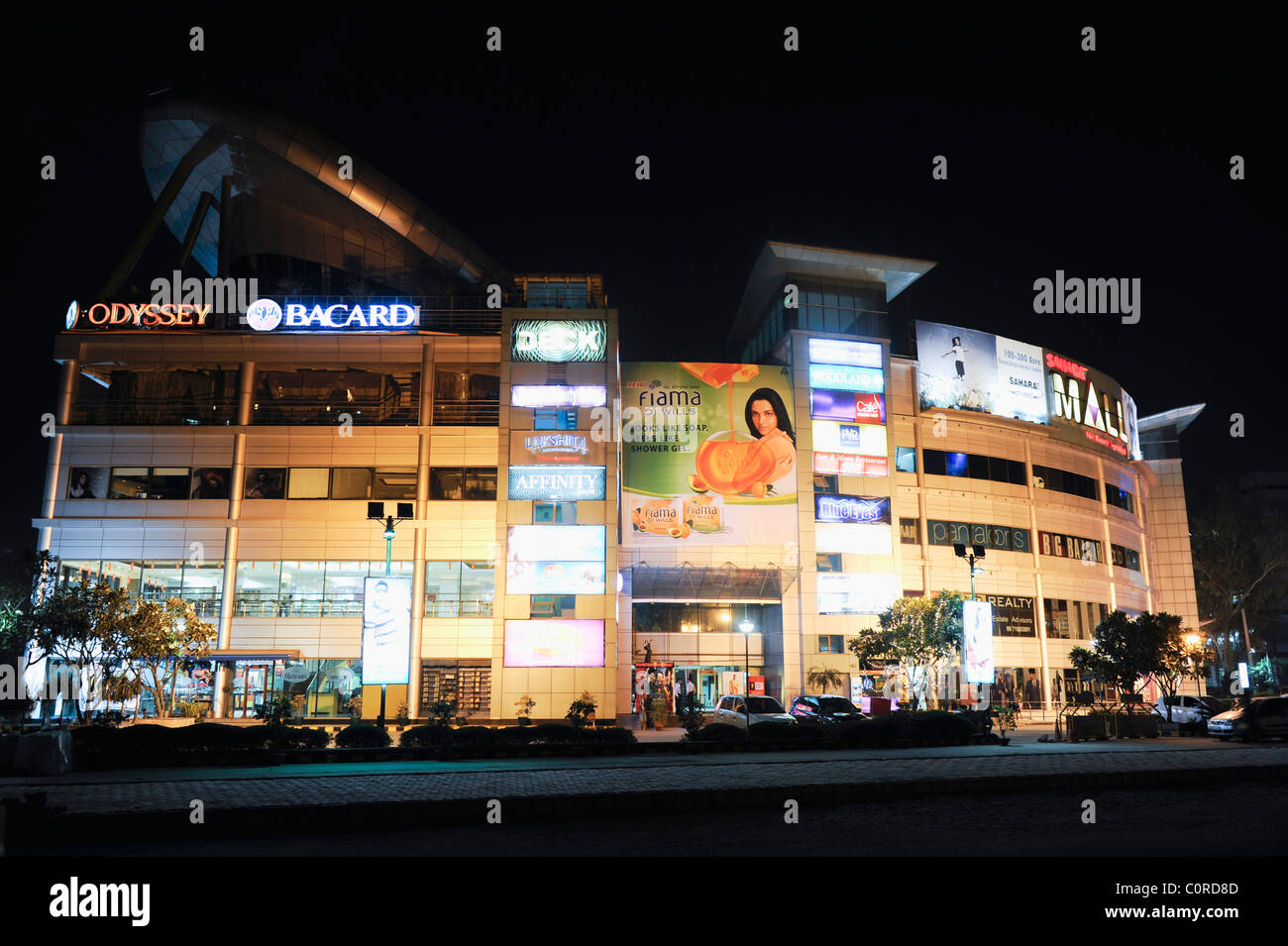 Shopping mall lit up at night, Sahara Mall, MG Road, Gurgaon, Haryana, India Stock Photo