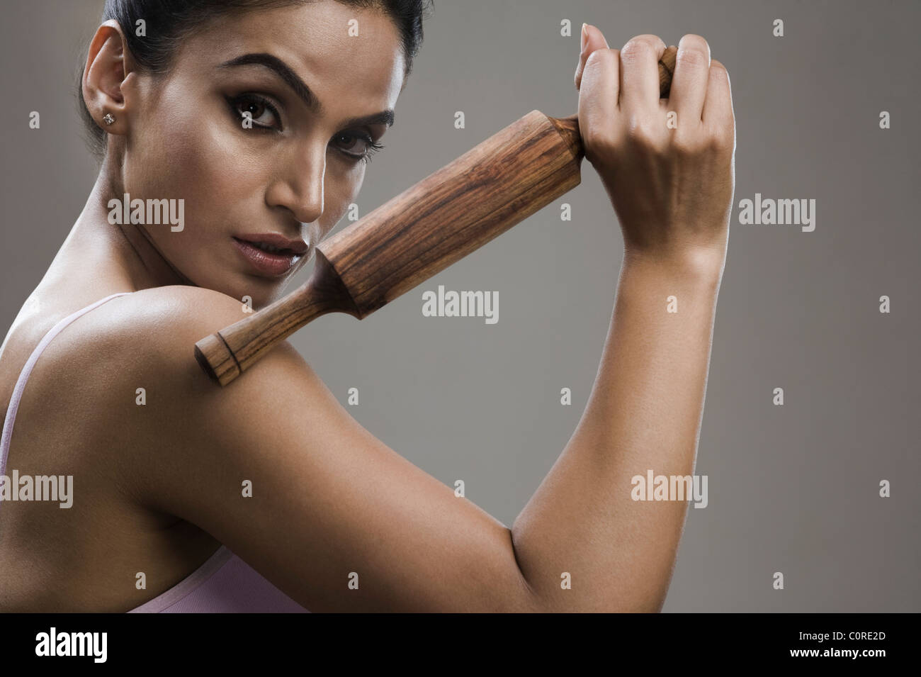 Portrait of a woman holding a rolling pin Stock Photo