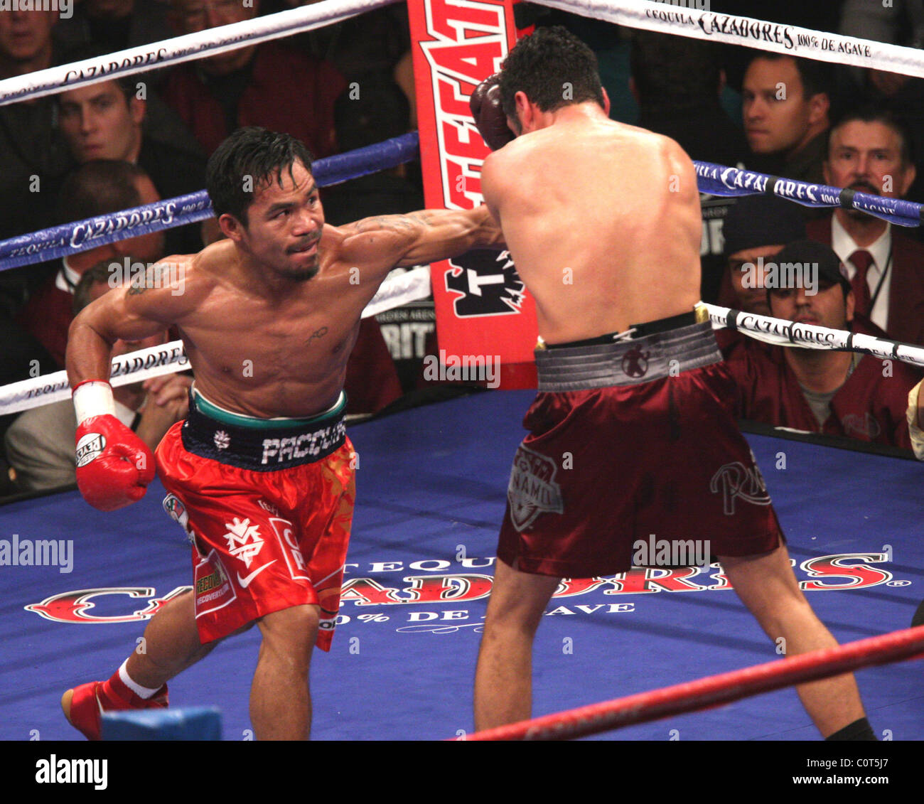 Manny Pacquiao beats Oscar de la Hoya by TKO in the 8th round in the