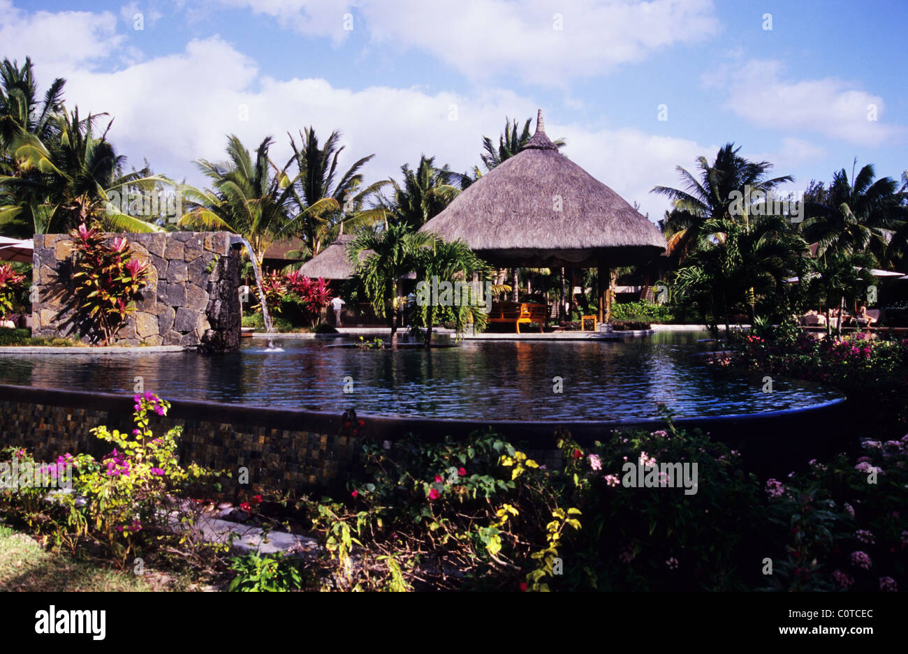 Les Pavillons Hotel. Le Morne Peninsula. Mauritius. Pool area, surrounded by lush tropical gardens. Stock Photo