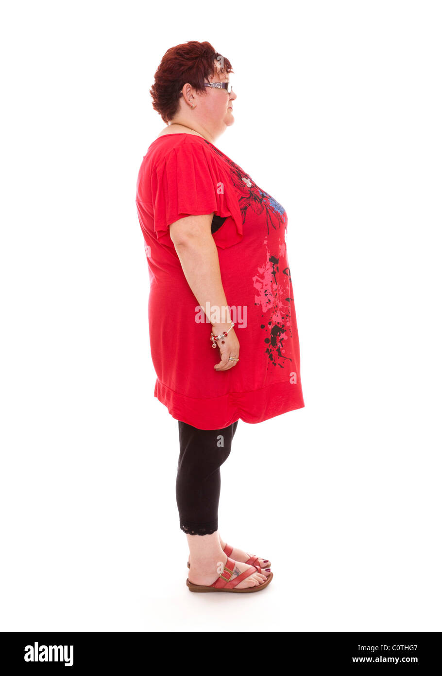 overweight woman standing upright Stock Photo