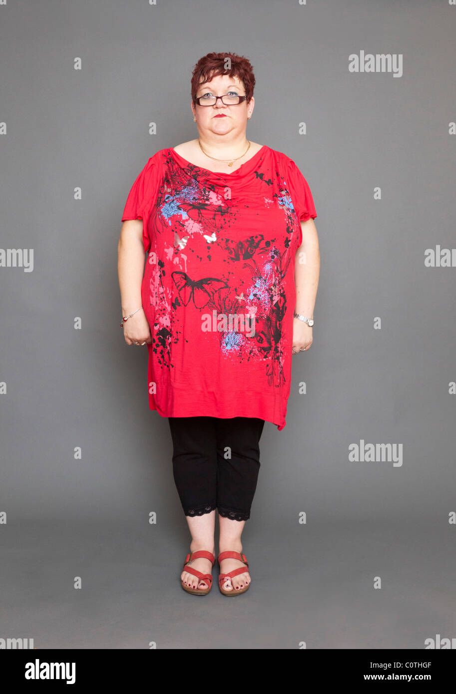 overweight woman standing upright Stock Photo