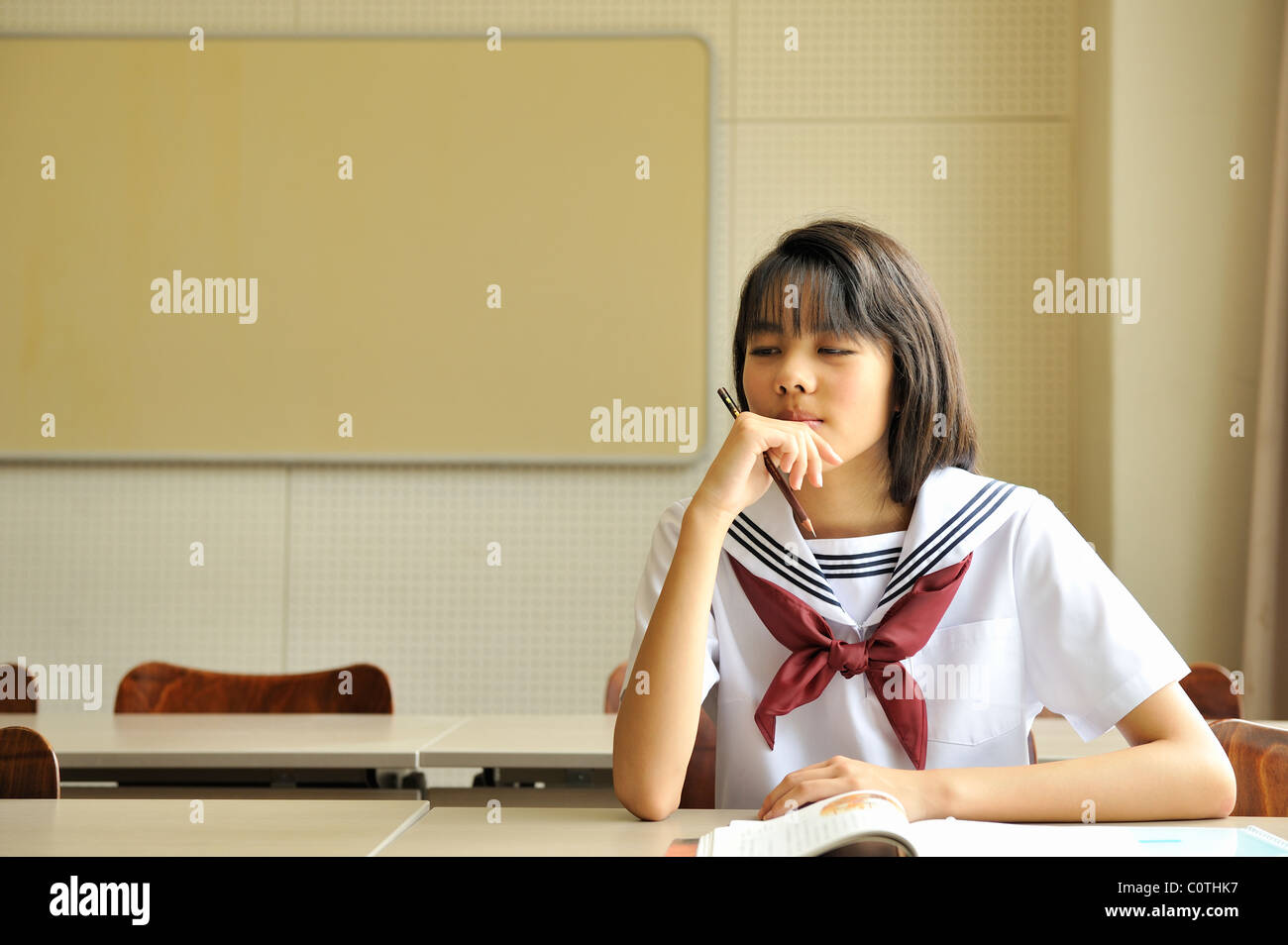 High School Girl Sitting in Classroom Stock Photo - Alamy