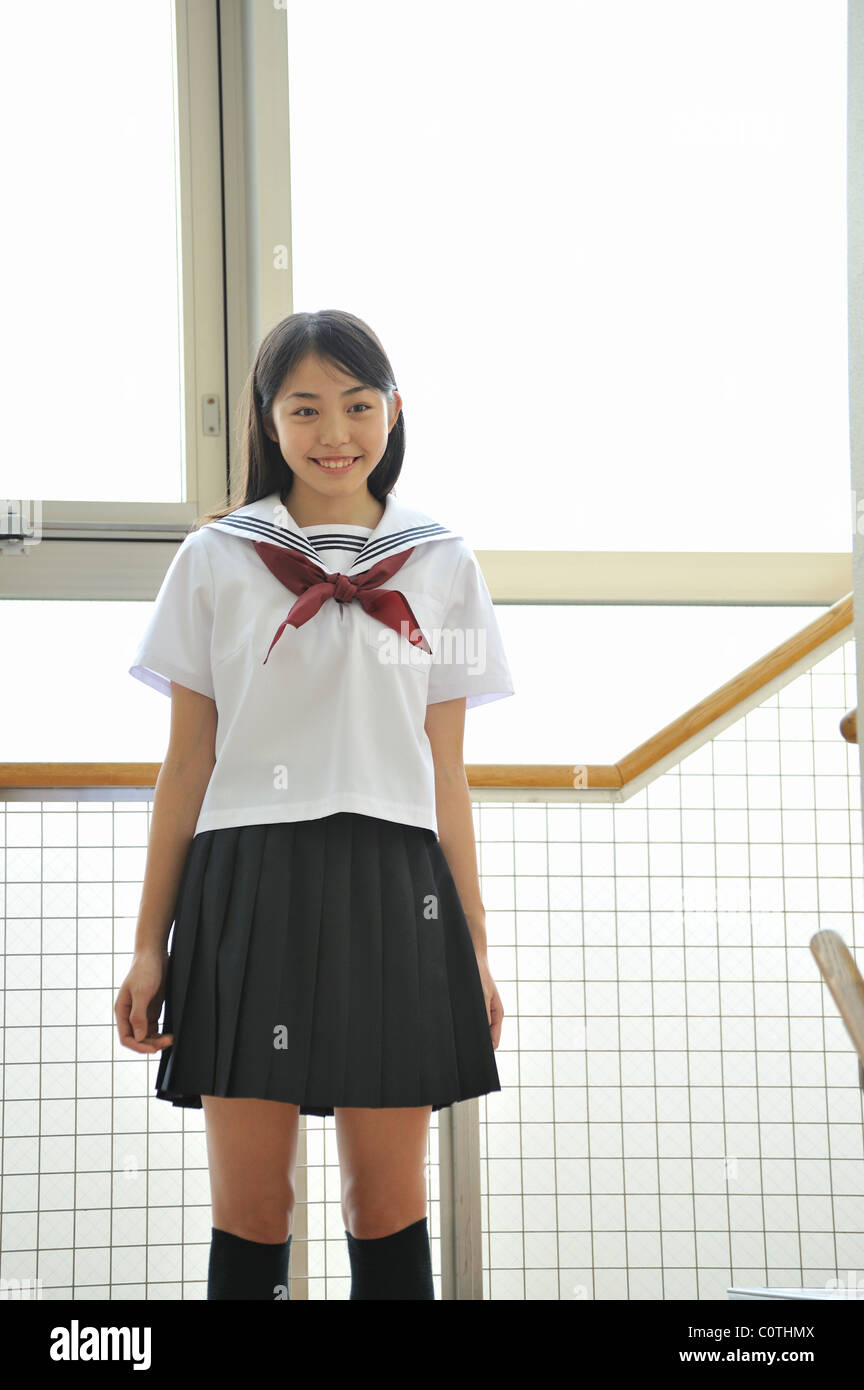 High School Girl Standing at Hallway Stock Photo - Alamy