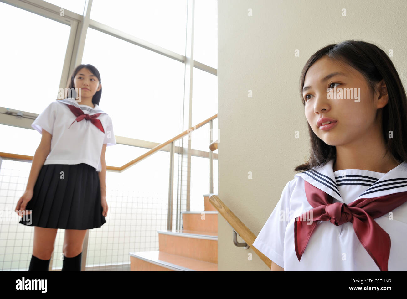 High School Girls Standing on Stairs Stock Photo - Alamy