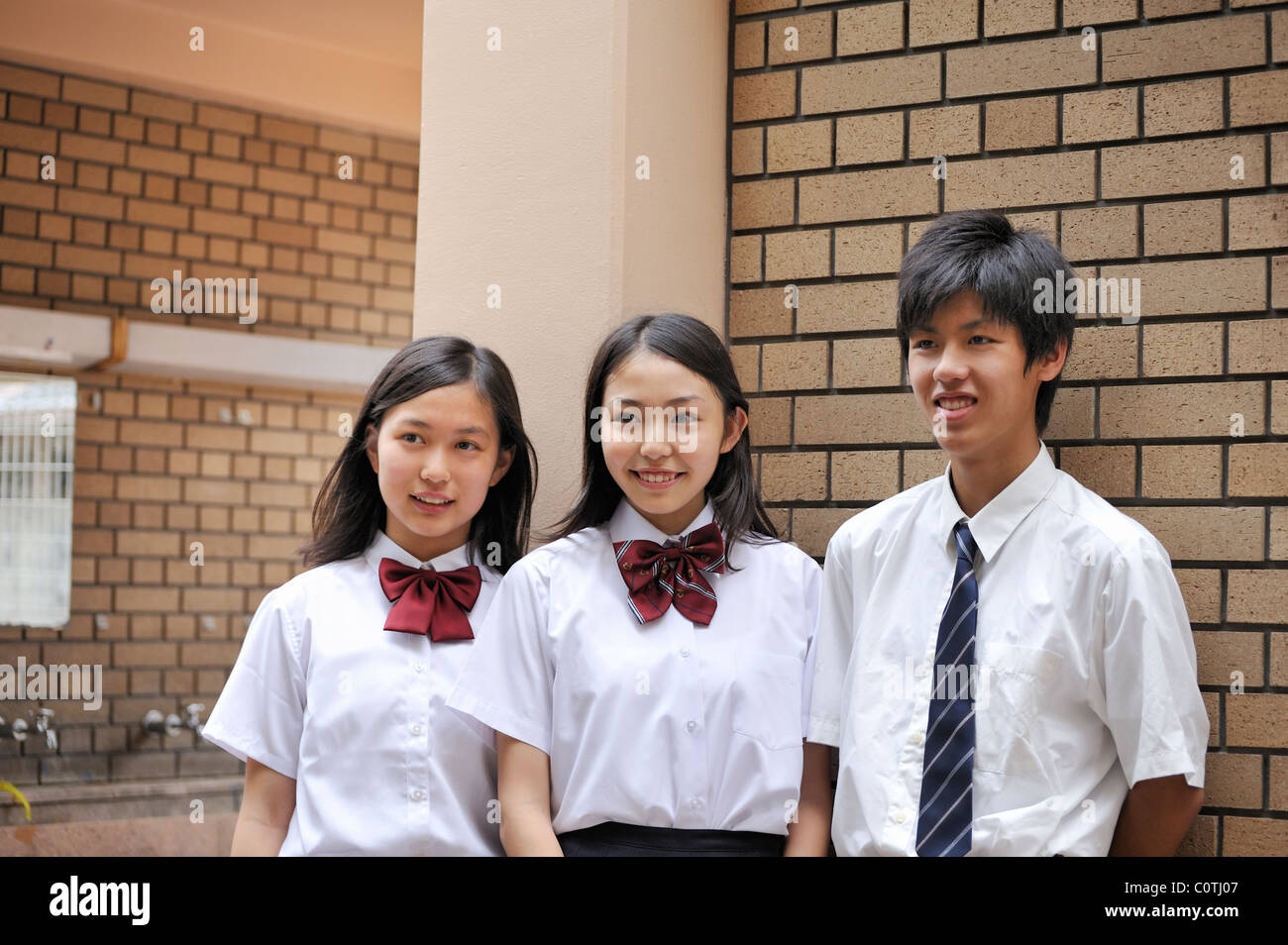 High School Boy and Girls Standing at Passage of School Stock Photo - Alamy