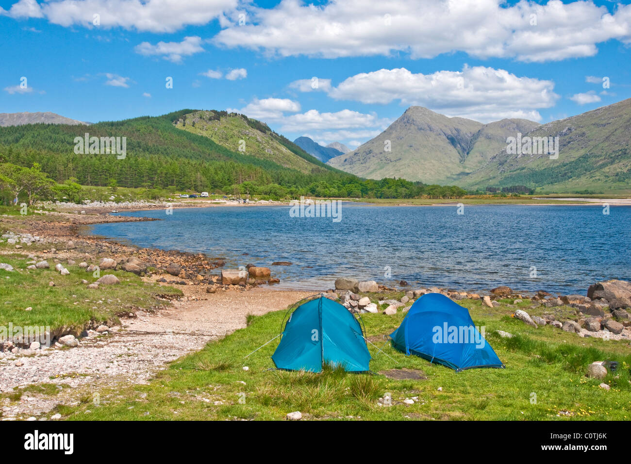 Campers on the shore of Loch Etive in Highland Scotland Stock Photo