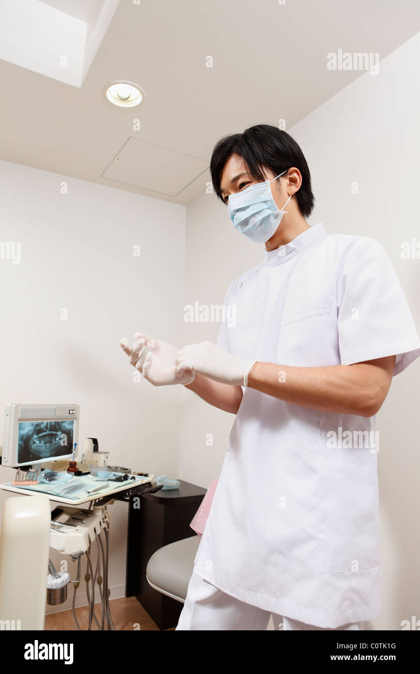 Dentist Wearing Surgical Glove Stock Photo Alamy