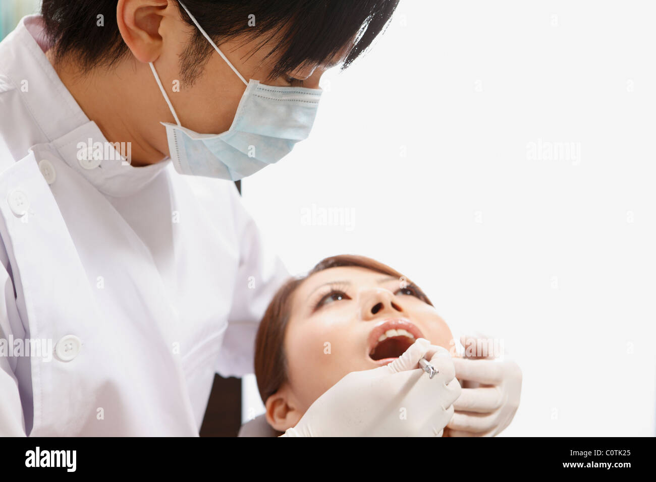 Dentist Taking a Look in Young Woman's Mouth Stock Photo Alamy