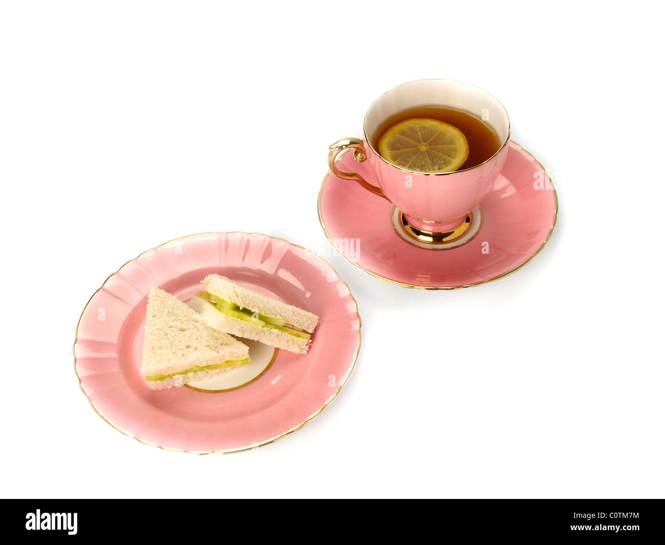 Pink tea cup, saucer and plate Stock Photo