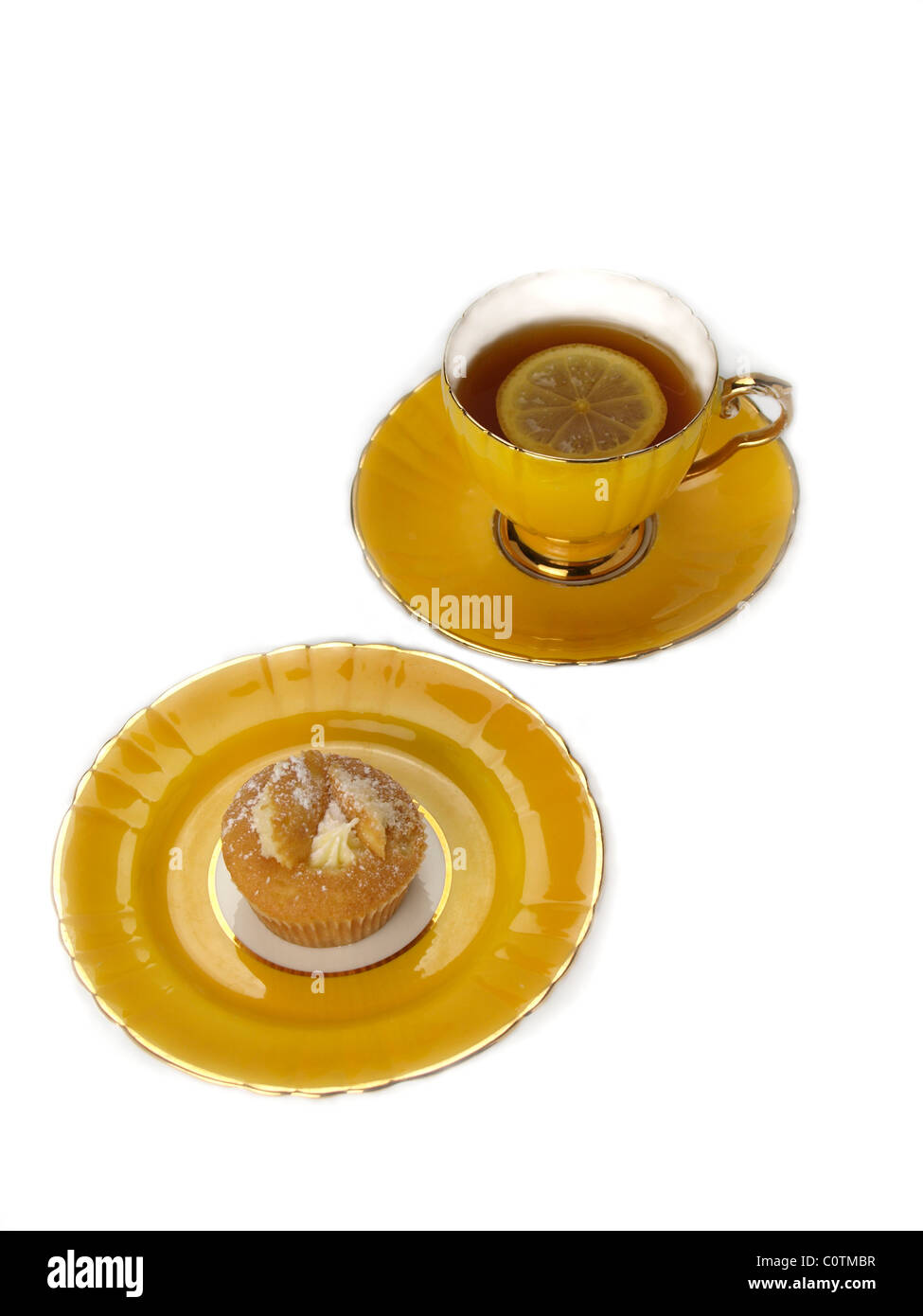 Yellow plate, cup and saucer Stock Photo Alamy