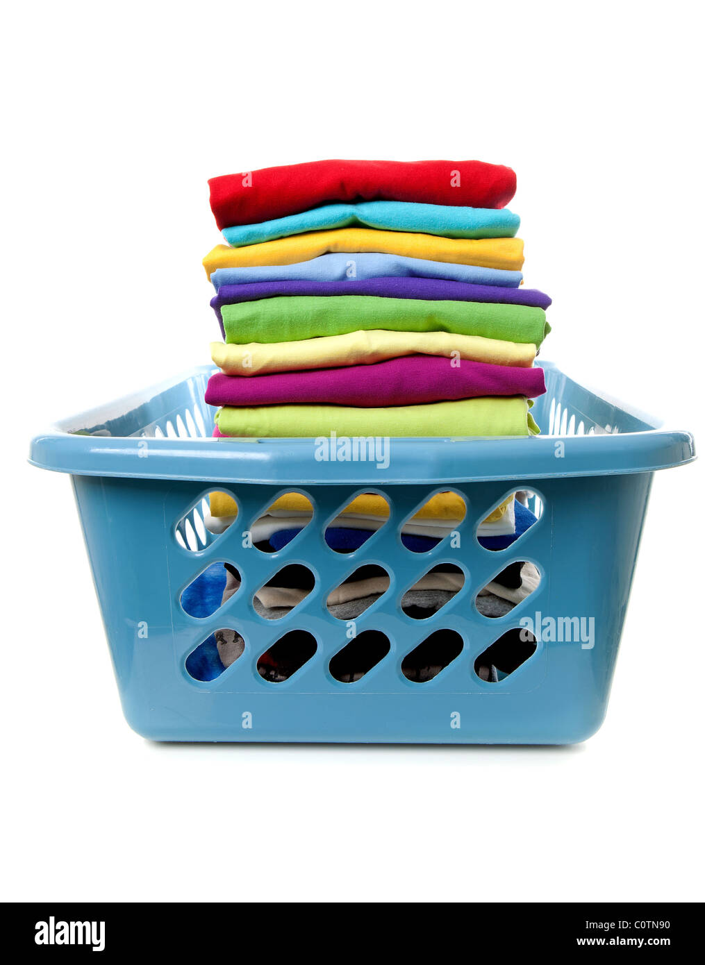 Laundry basket with folded clothes over white background Stock Photo