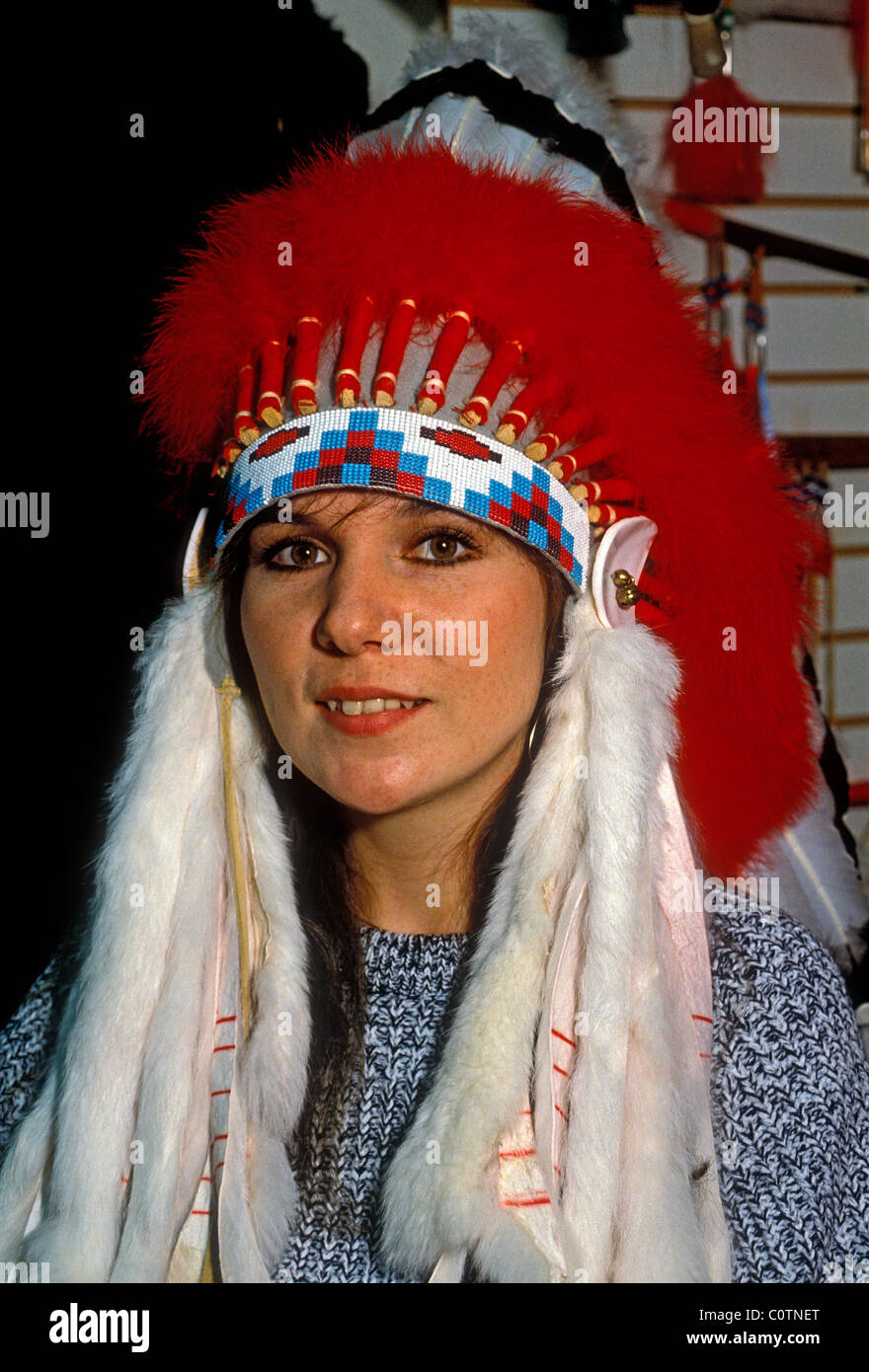 French-Canadian woman, salesclerk wearing Sioux war bonnet, boutique shop,  Petit-Champlain Quarter, Quebec City, Quebec Province, Canada Stock Photo -  Alamy