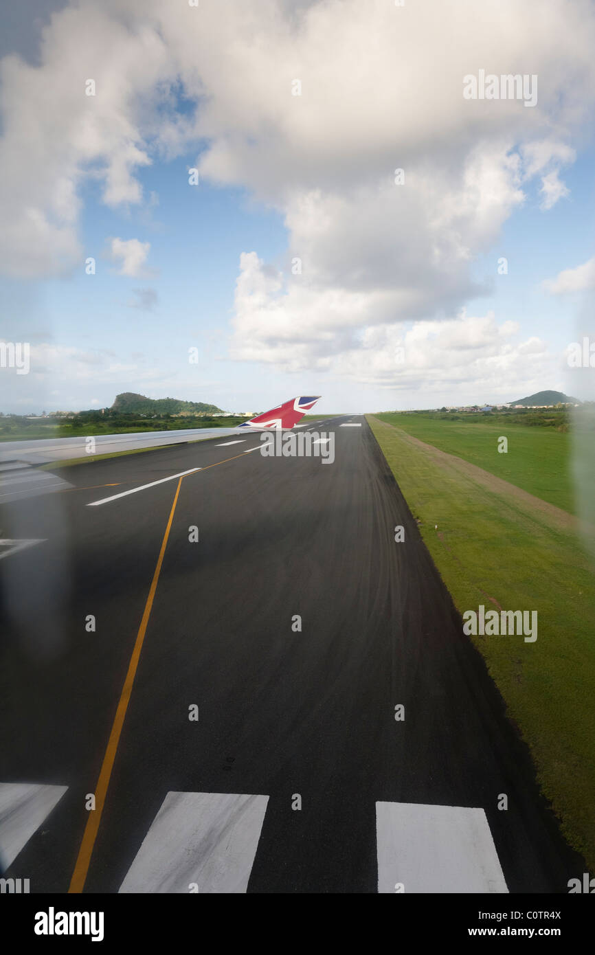 View from a Virgin Atlantic airliner looking down the runway at Hewanorra International Airport, St lucia. Stock Photo