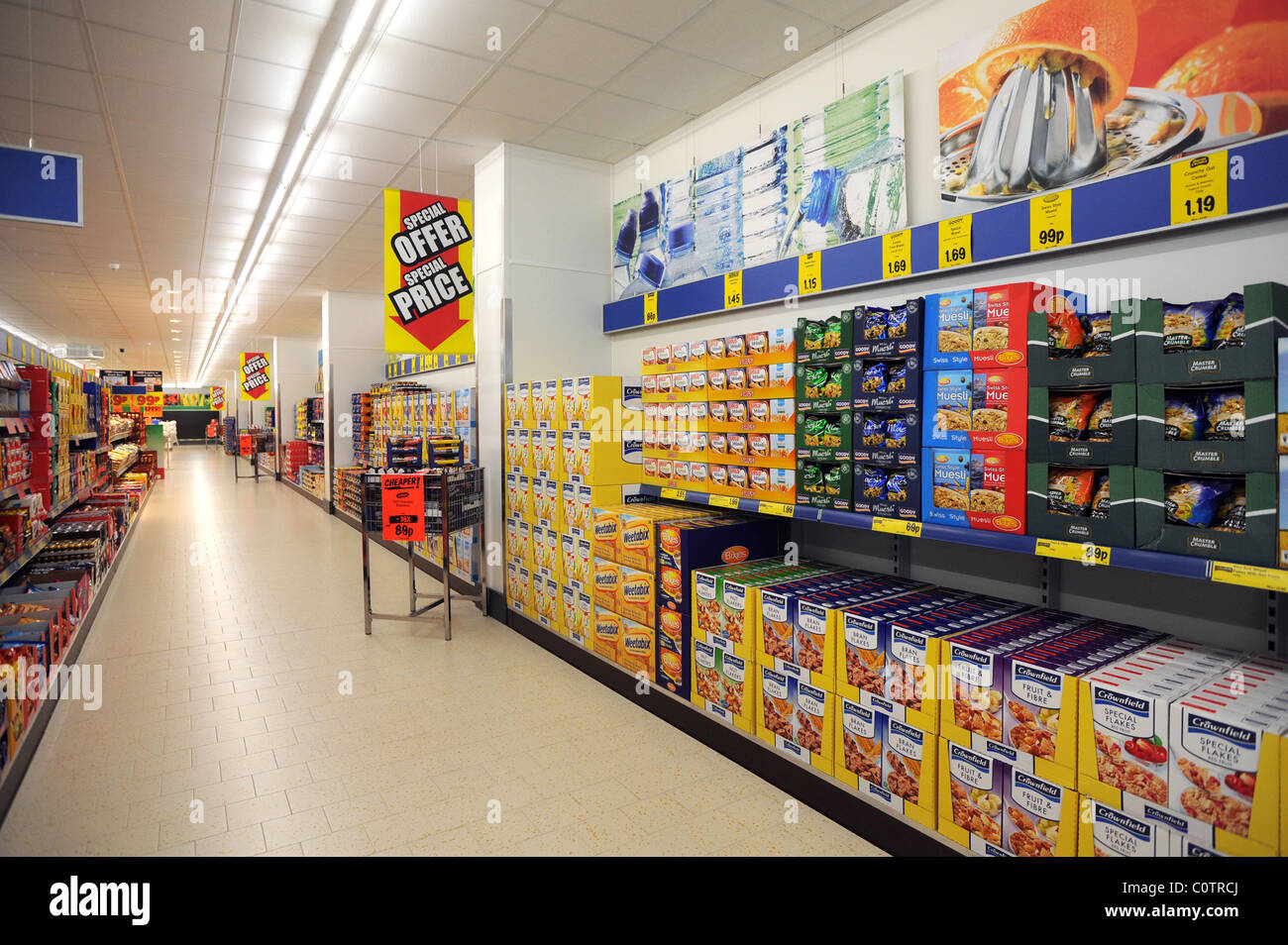 Lidl discount supermarket in Newhaven empty aisle with goods filling the shelves Stock Photo