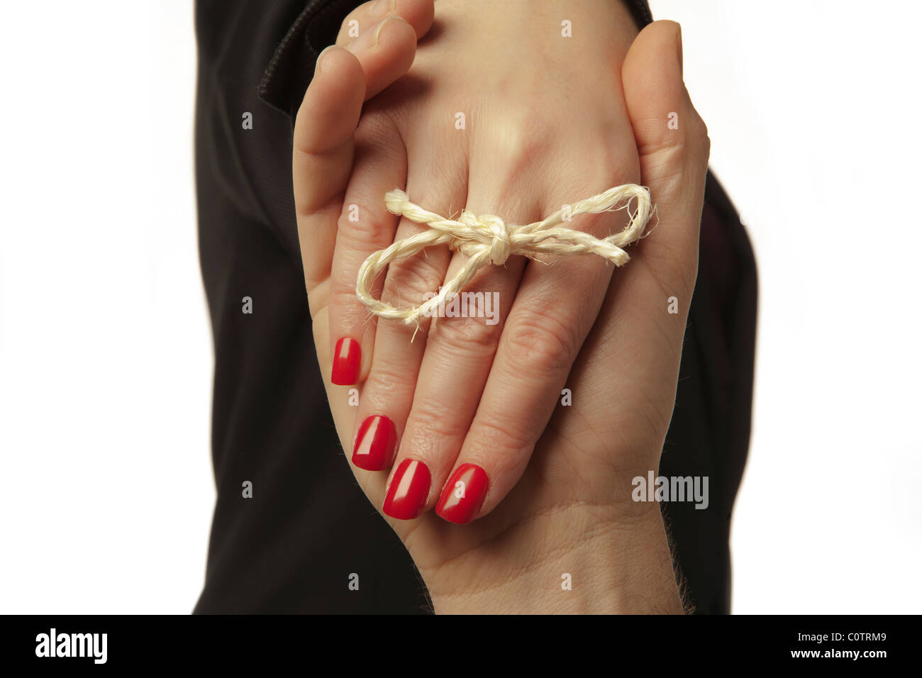 Hand string tie knot hi-res stock photography and images - Alamy