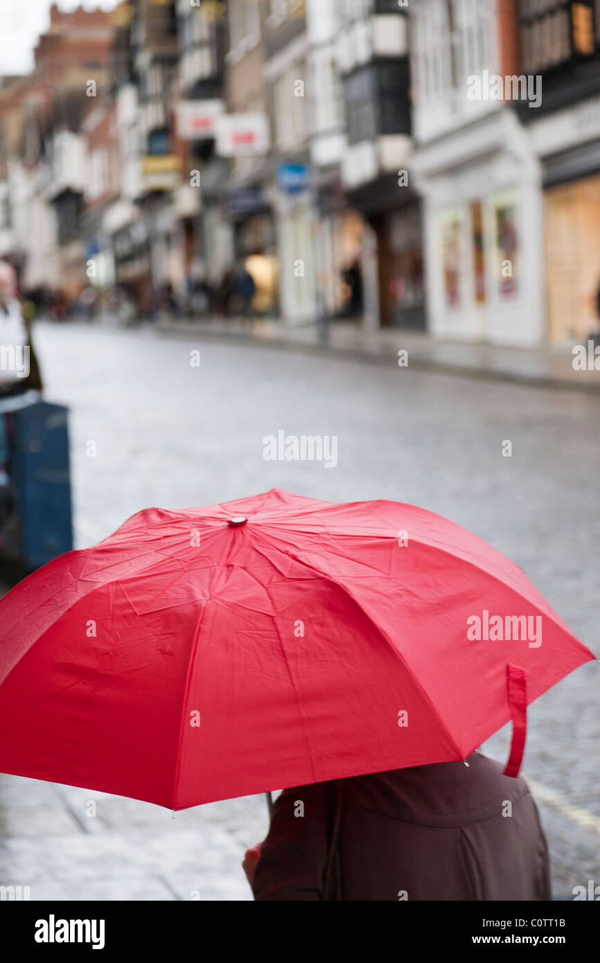 Woman with red umbrella walking in the rain Stock Photo Alamy