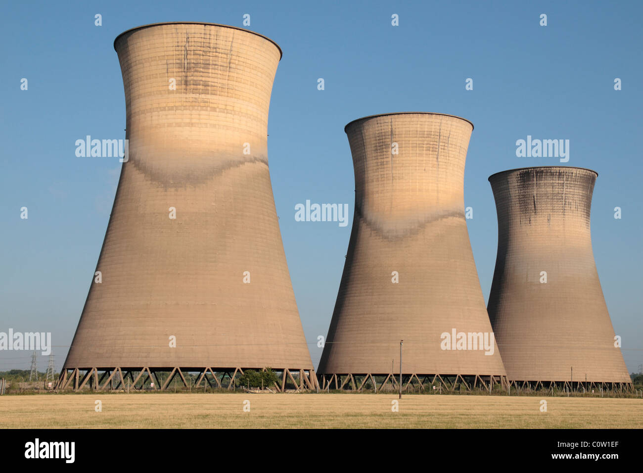 Three of the five cooling towers of the disused Willington power station, Derbyshire, England, UK. Stock Photo