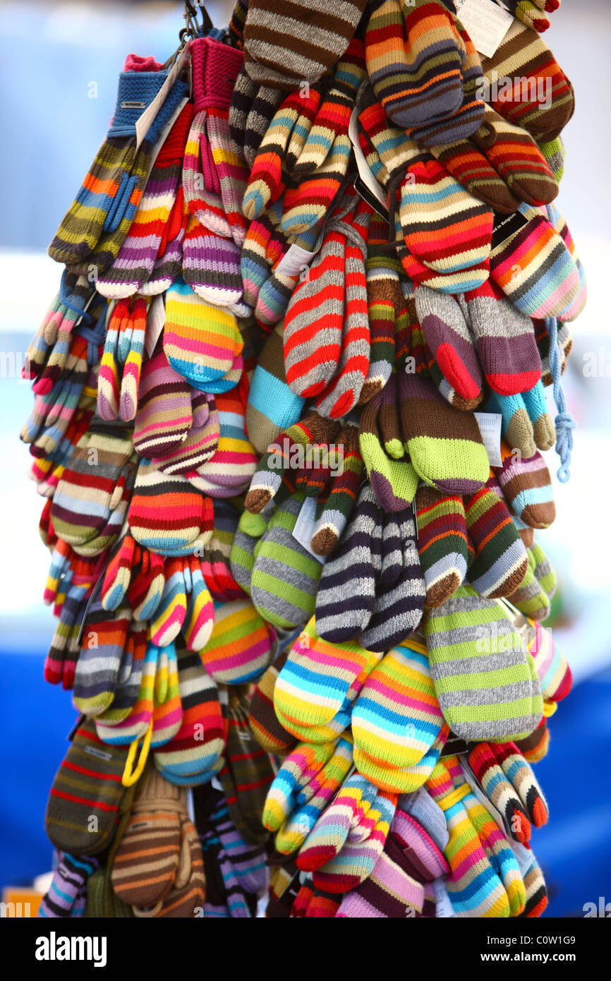 Warm cloves, made of wool, colorful design. Sold on a market. Stock Photo