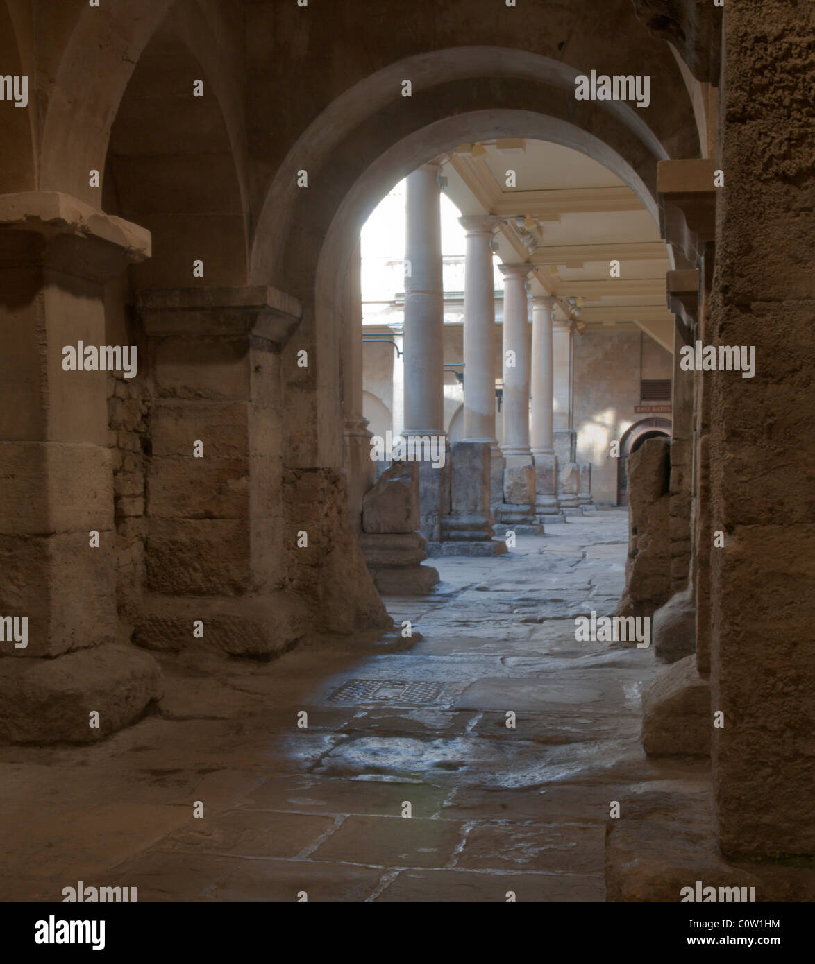 View through to the area and pillars of the Great Bath. The Roman Baths, Bath, Somerset, UK. Stock Photo