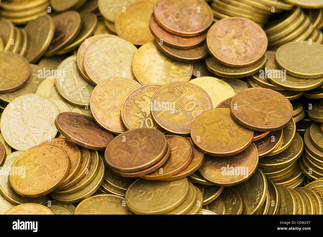 Pile of golden coins isolated on white Stock Photo - Alamy