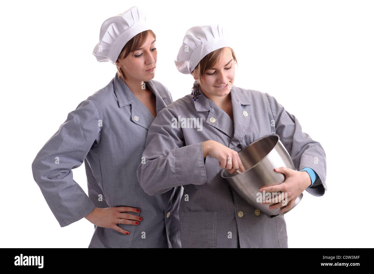 two young apprentice cooksisolated on white background Stock Photo - Alamy