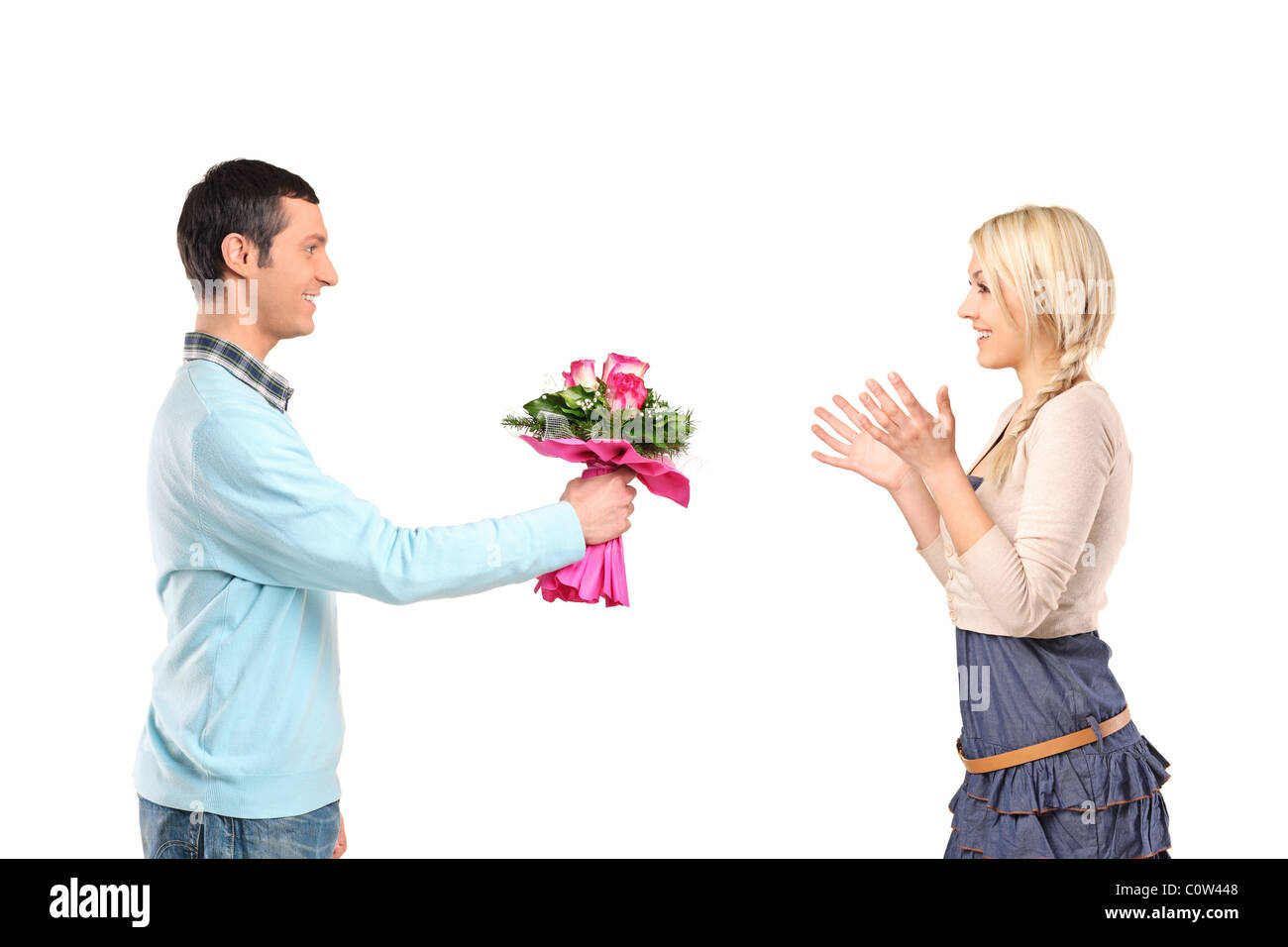 Boyfriend giving flowers to his surprised girlfriend Stock Photo Alamy