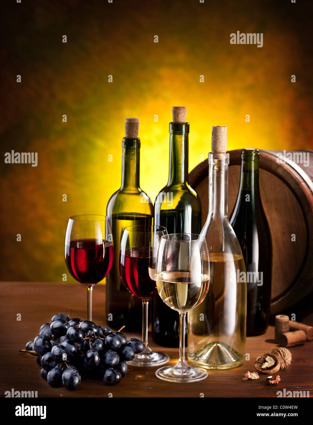 Still life with wine bottles, glasses and oak barrels Stock Photo - Alamy