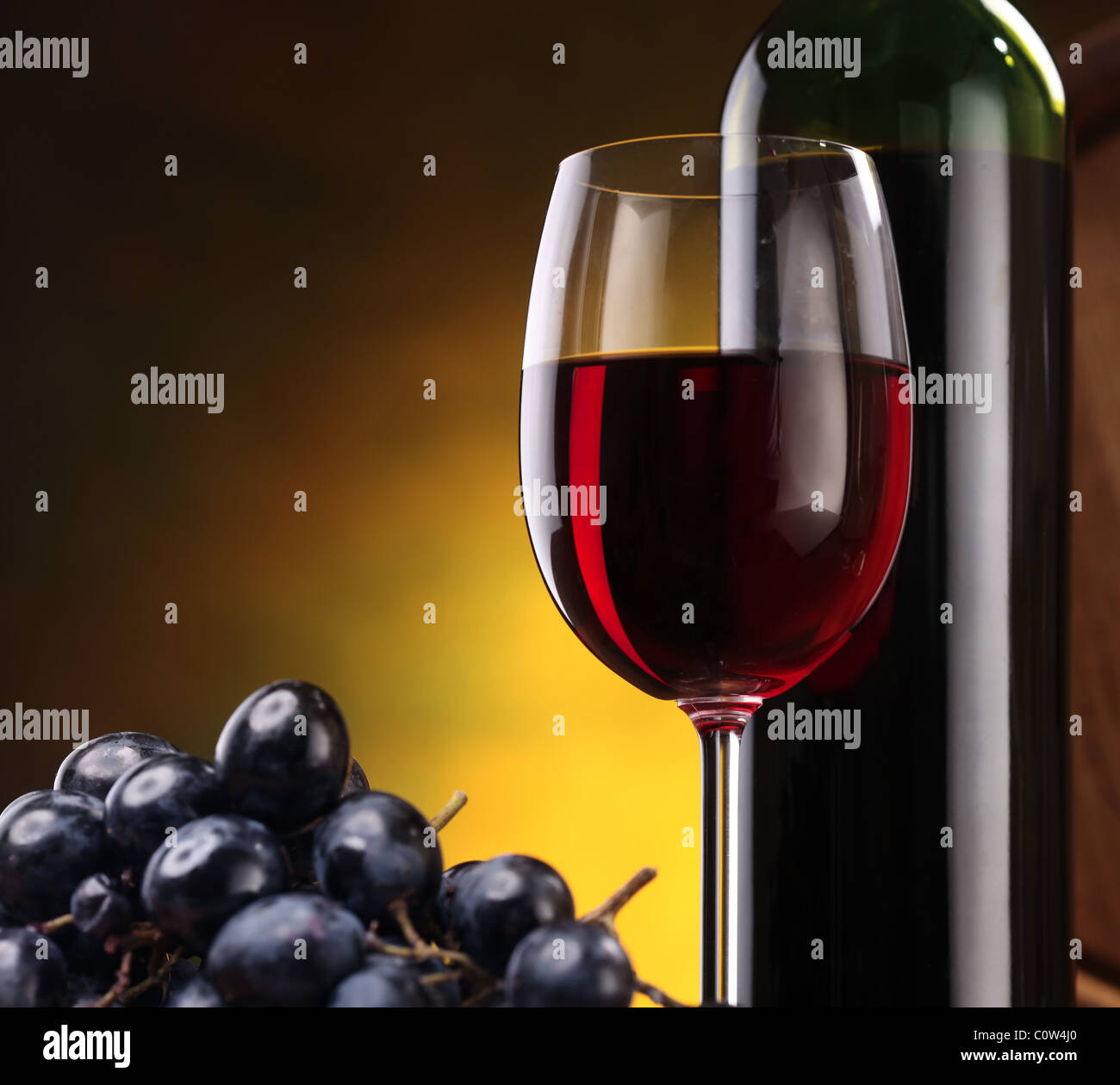 Still life with wine bottle, glass and grapes Stock Photo - Alamy