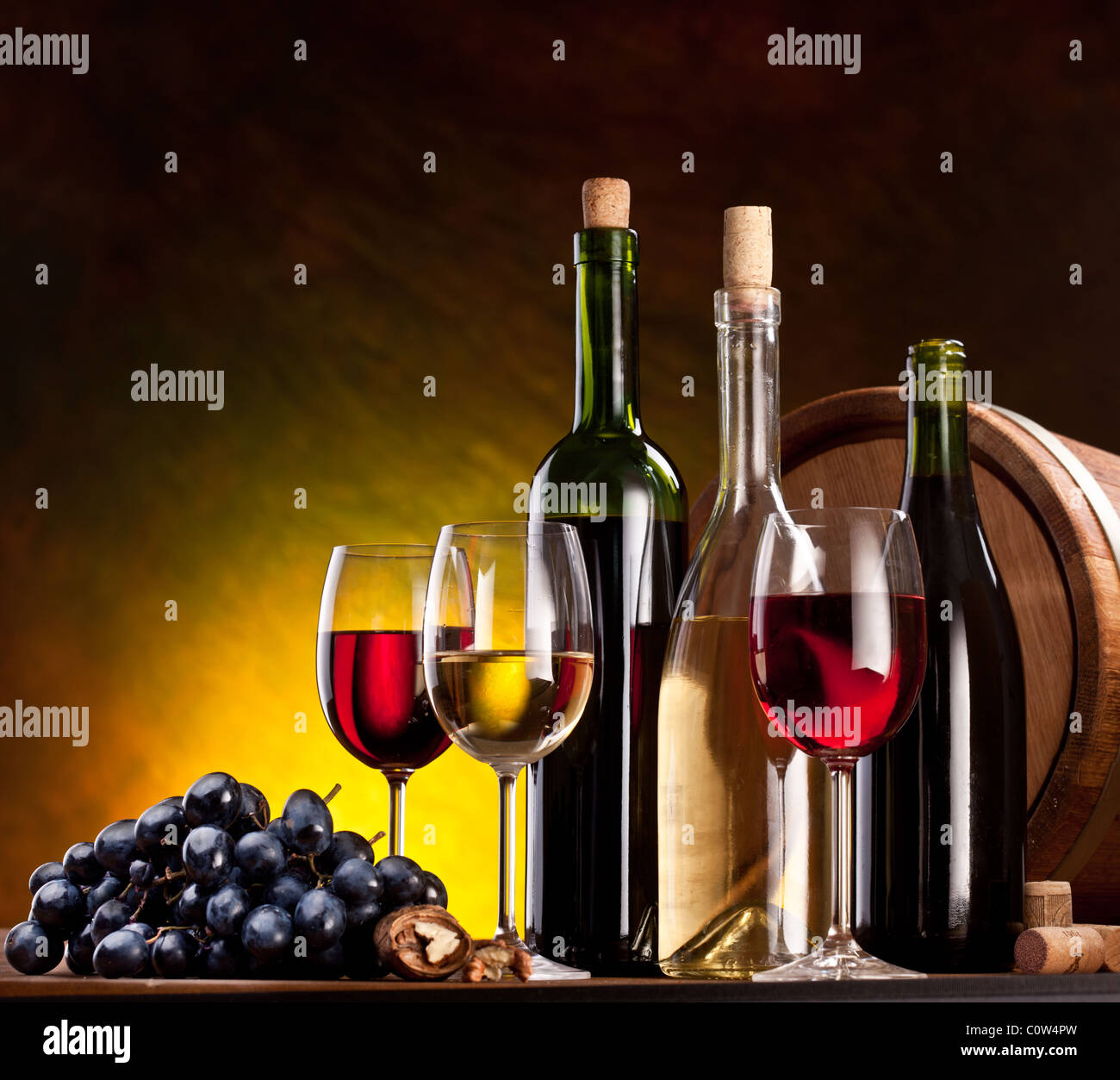 Still life with wine bottles, glasses and oak barrels Stock Photo - Alamy