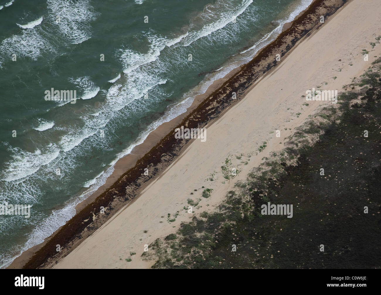 aerial view above receding tide sandy beach Padre island Texas Stock Photo
