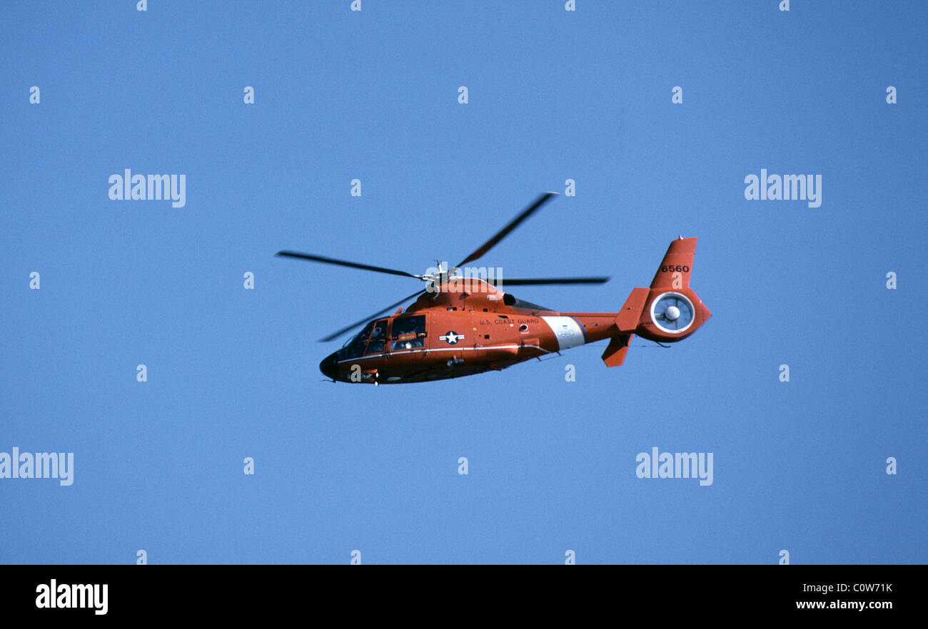 US Coast Guard helicopter over California coast. Stock Photo