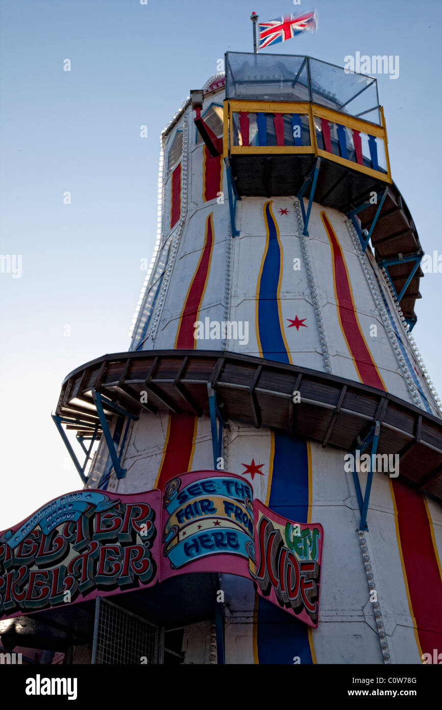 Funfair ride on Brighton Pier against a blue sky Stock Photo Alamy