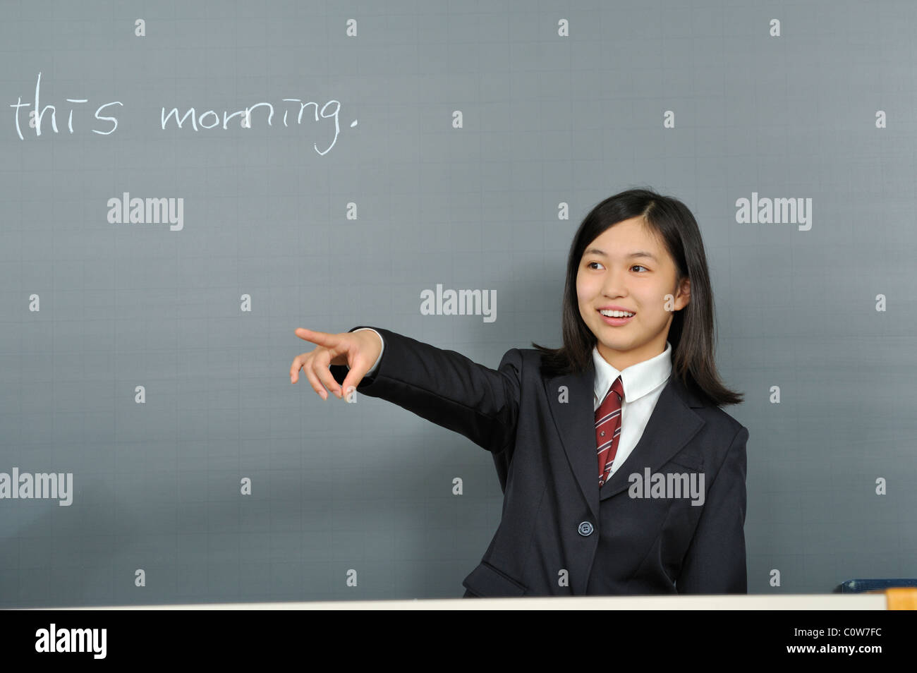 High School Girl Standing in front of Blackboard Stock Photo - Alamy
