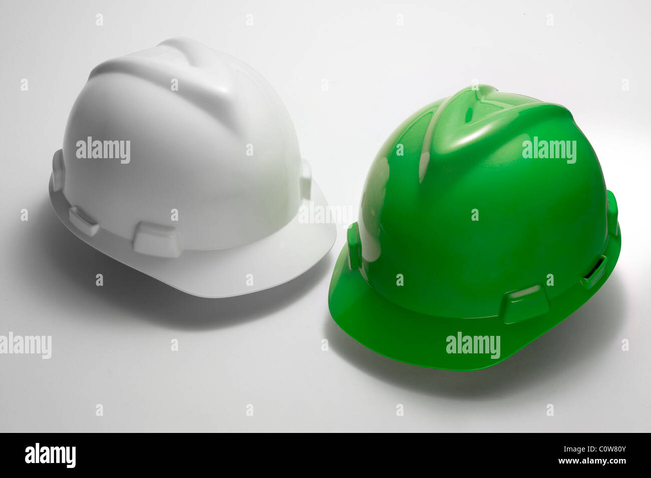 White And Green Hard Hats High Resolution Stock Photography and Images