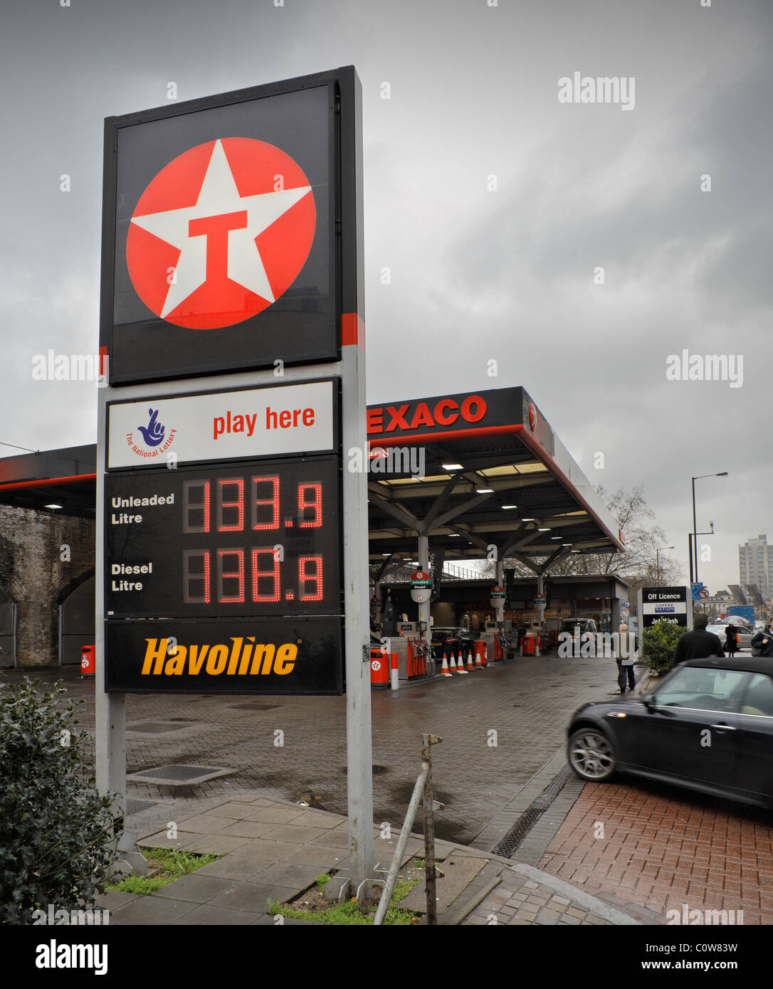 Petrol station displaying high fuel prices. Stock Photo
