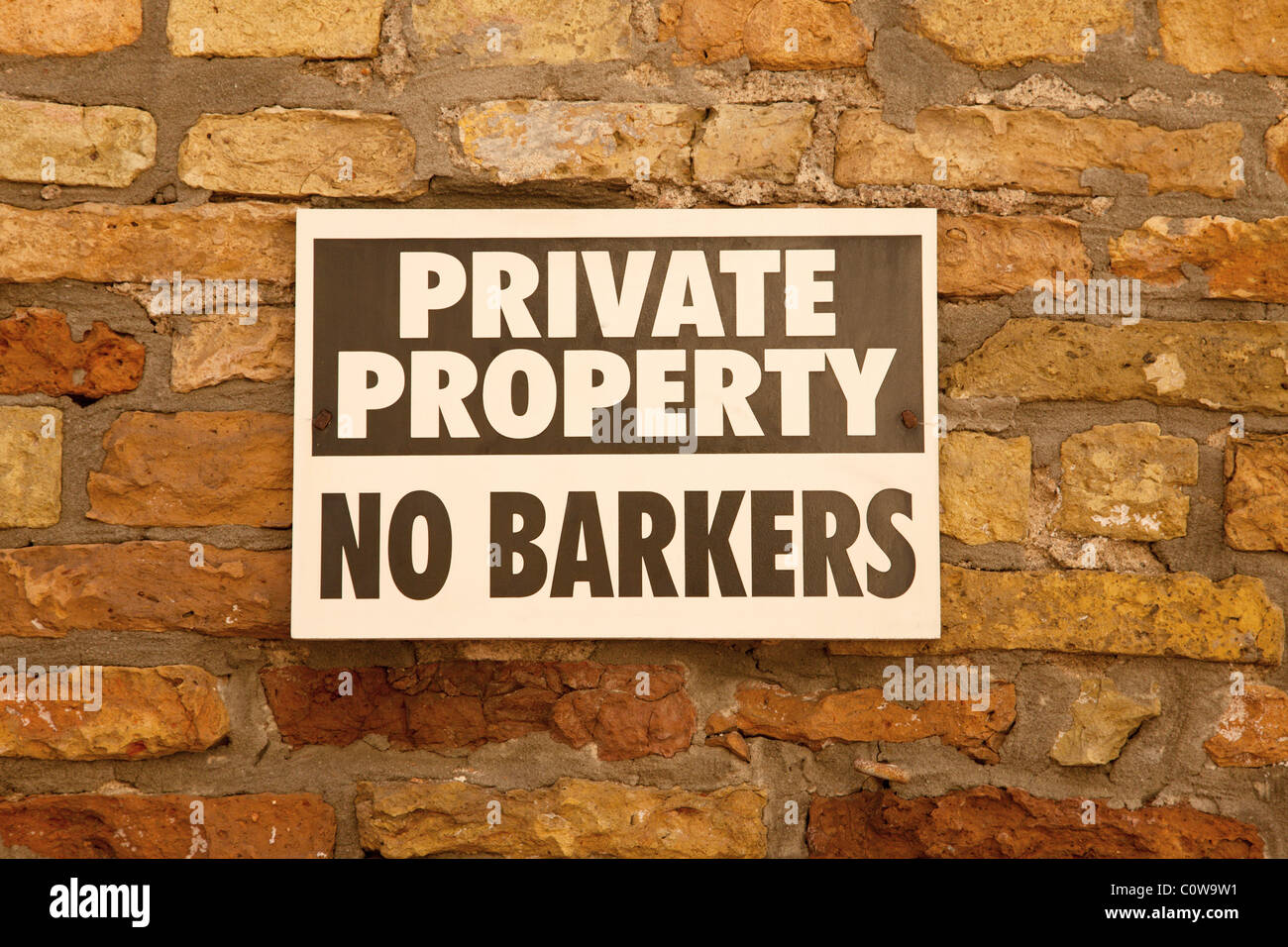 Private Property Sign on Brick Wall Stock Photo