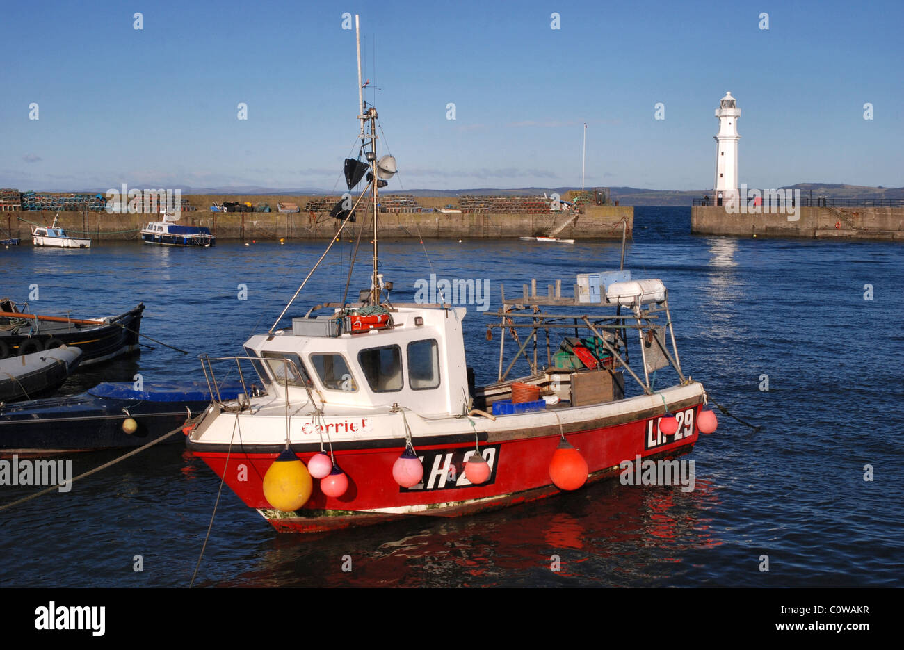 A bright sunny morning at Newhaven Harbour on the Firth of Firth in Edinburgh, Scotland, UK. Stock Photo