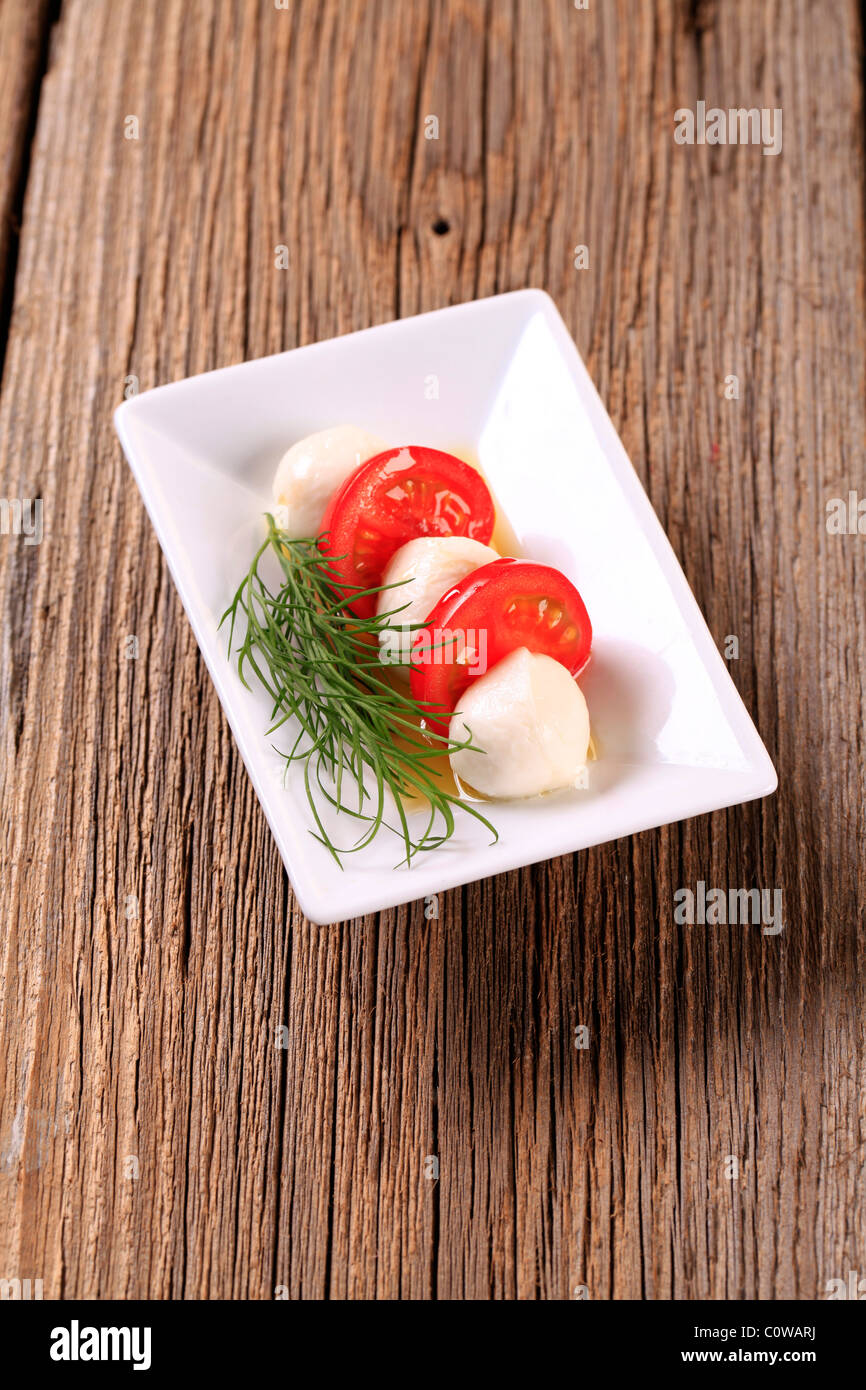 Marinated mozzarella cheese balls and fresh tomato Stock Photo Alamy