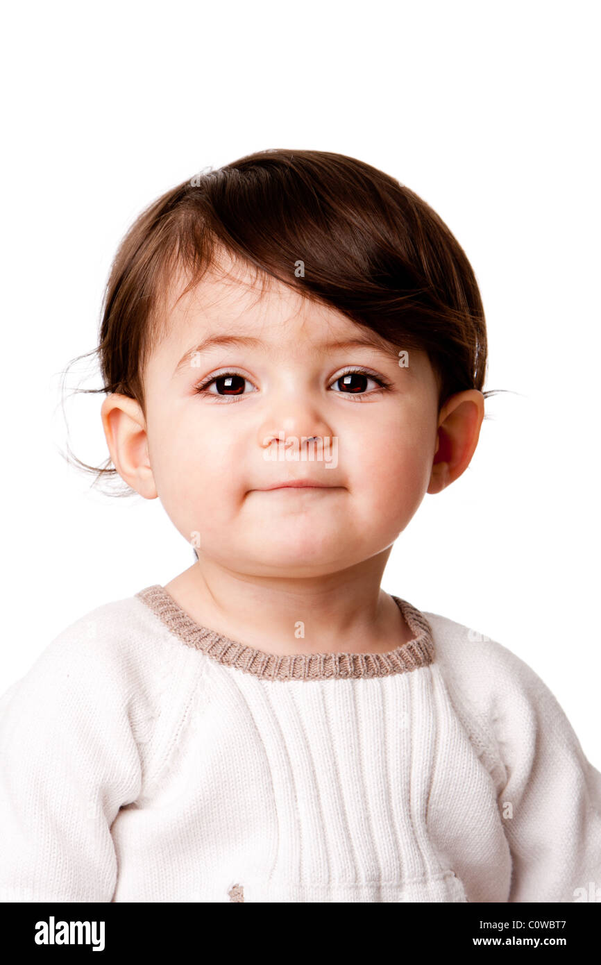 Face of a cute adorable baby infant toddler with innocent expression, isolated. Stock Photo