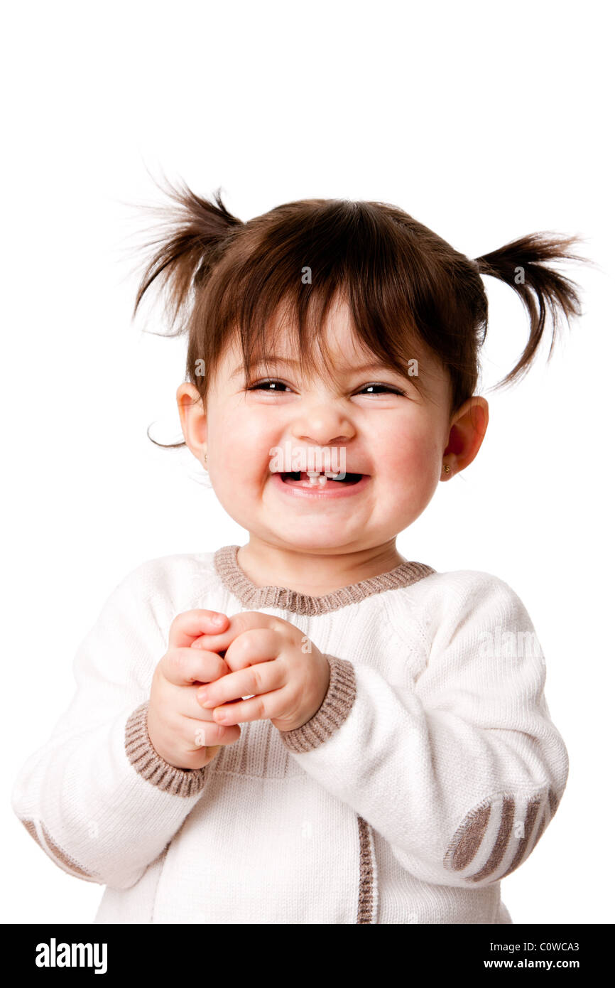 Beautiful expressive adorable happy cute laughing smiling baby infant toddler girl with ponytails showing teeth, isolated. Stock Photo