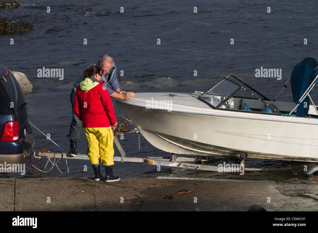 Launch and retrieval of a boat at a public launch ramp in Victoria, British Columbia, Canada Stock Photo