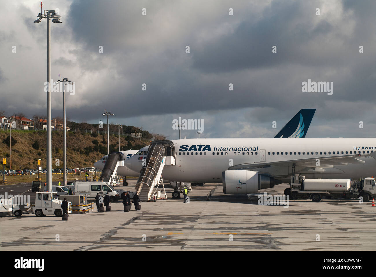 Crew from SATA International airline entering the plane for another flight with departure from the Azores Islands Stock Photo