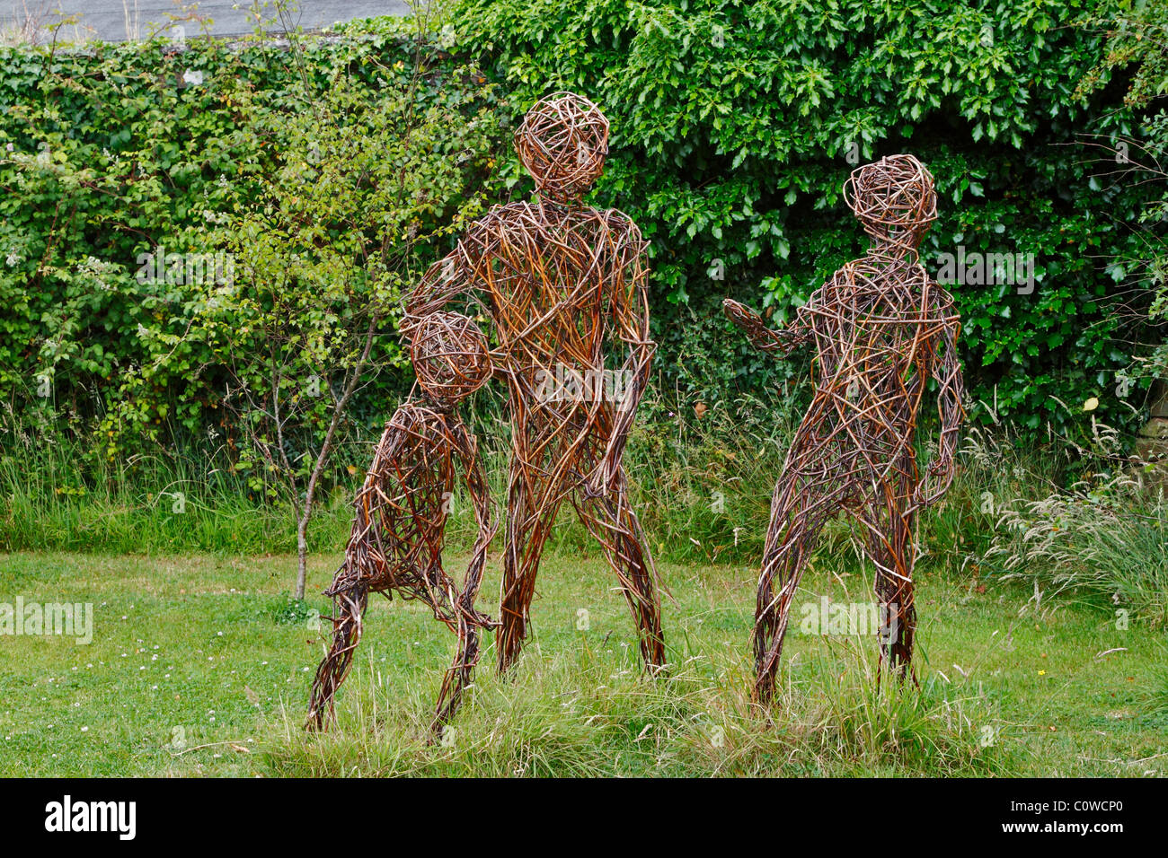 Willow Family Sculptures Lost Gardens Of Heligan Cornwall Stock Photo willow-family-sculptures-lost-gardens-of-heligan-cornwall-stock-photo