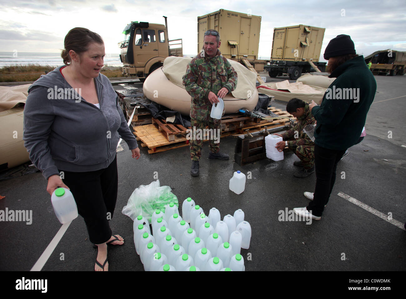 Residents of New Brighton, Christchurch, at the NZ Defence Force's desalination unit after the 6.3 magnitude earthquake Stock Photo